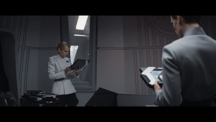 Lieutenant Dedra Meero and her assistant stand in her office reading their data pads looking deeply focused at their research on recent thefts of Imperial property.