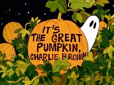 Title card for It's The Great Pumpkin, Charlie Brown showing a ghost peeking out from behind a pumpkin in a pumpkin patch.