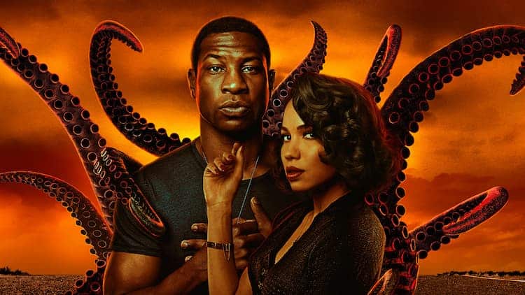 Characters Atticus Freeman and Letitia Lewis pose in front of reaching tentacles and a fiery sky.