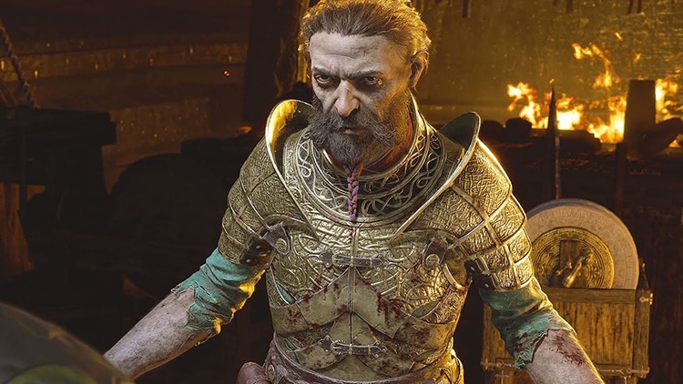 Sindri in a fire-lit room wearing beaten gold armor looking defeated. 