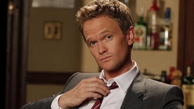 Barney Stinson from How I Met Your Mother posing in a suit and tie.