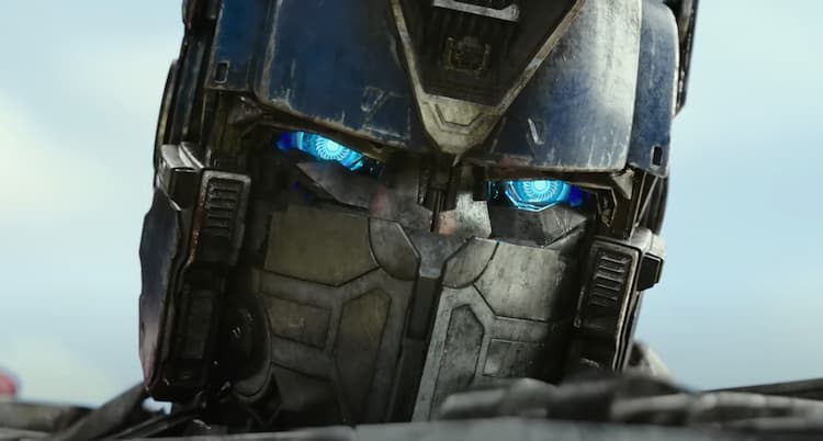 A close up of Optimus Prime with his battle mask covering the lower portion of his face.