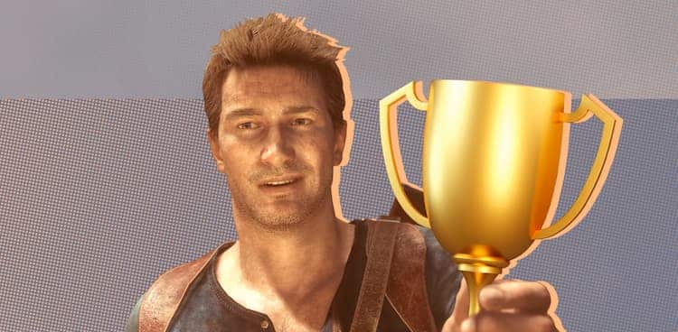 Nathan Drake from Uncharted holding a gold trophy