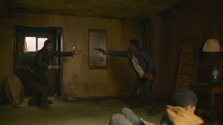 Joel and Henry in a standoff while Sam attacks Ellie