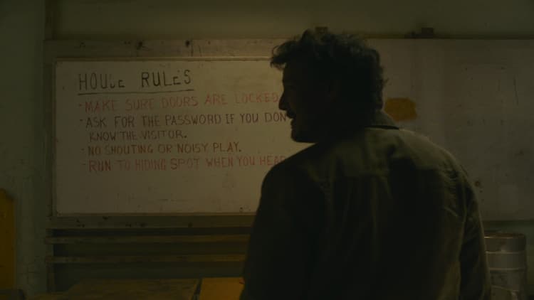 Joel stood in front of the House Rules of the refuge
