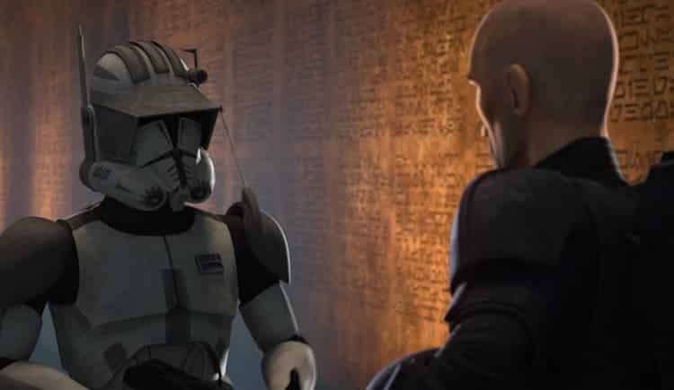Commander Cody and Crosshair are talking in front of a memorial wall covered in names.
