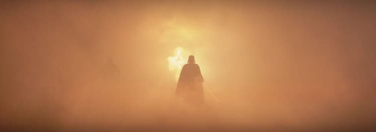 Vader walks towards a yellow mist caused by an explosion
