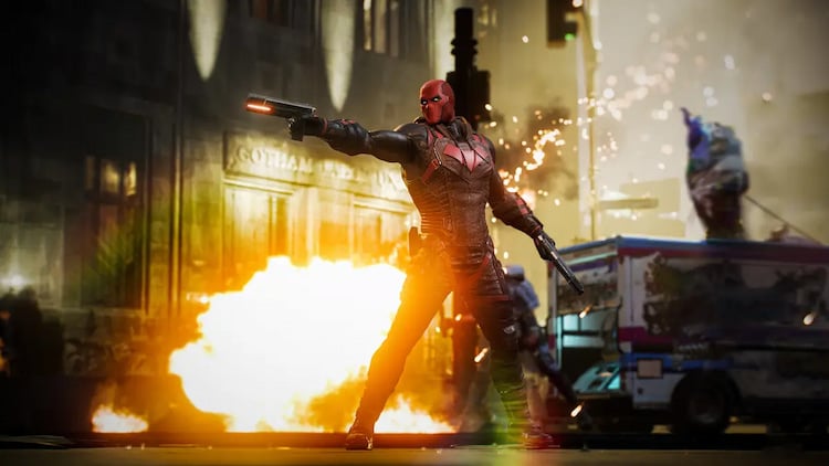An armored vigilante fires his pistol in front of an explosion and an ice cream truck