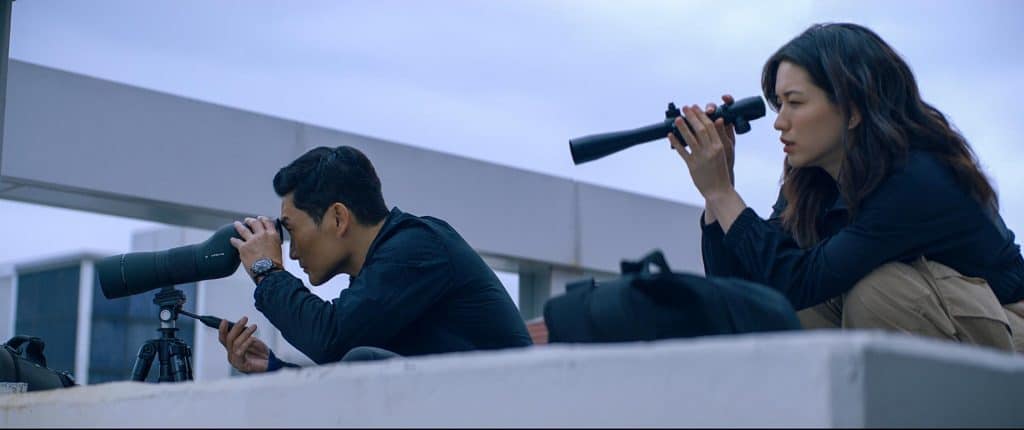 Daniel Dae Kim and Reina Hardesty doing spy stuff.