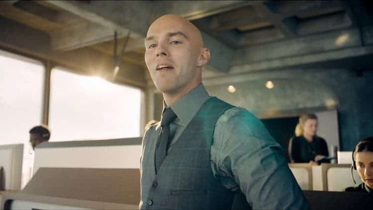 Lex Luthor is standing in his control room. He is looking down with a satisfied look on his face. LuthorCorp workers are at computers behind him. The sun is coming in from all angles, as the walls are made of windows.