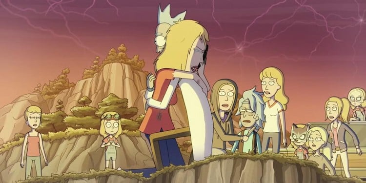 Rick is hugging Beth. There are many other versions of Beth standing around them, watching.