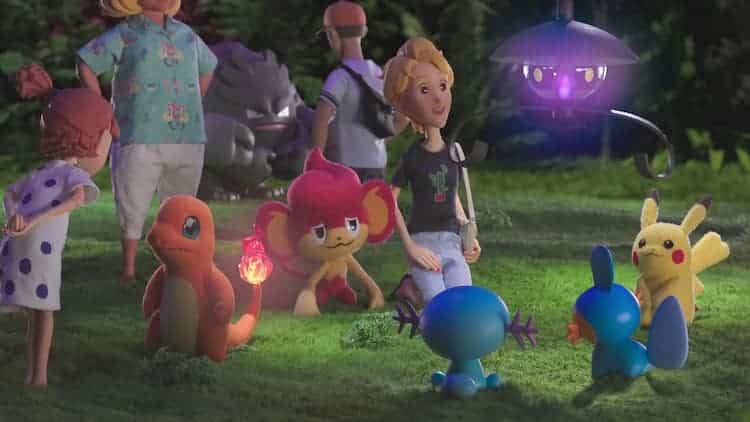 A gathering of people and Pokémon. Charmander, Pansear, Wooper, Mudkip, Pikachu, Lampent, and Graveller are in the open area alongside various people. The area is being lit up by Charmander and Lampent.