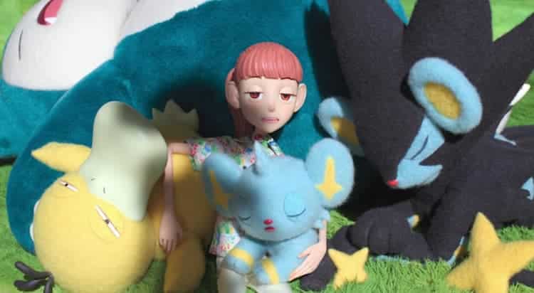 Haru is sleeping in a field alongside Psyduck, Shinx, and Luxray. They are sleeping on a Snorlax, who is also sleeping.