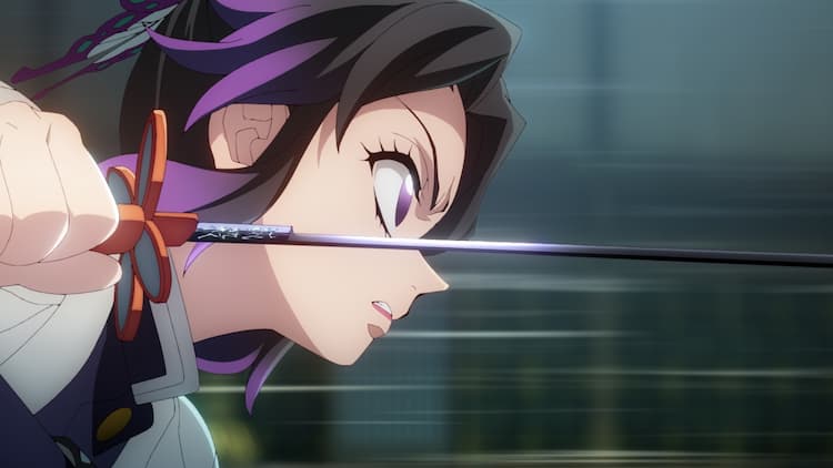 Shinobu is charging forward with her sword, getting ready to strike. She has a look of anger on her face. She is moving extremely fast.