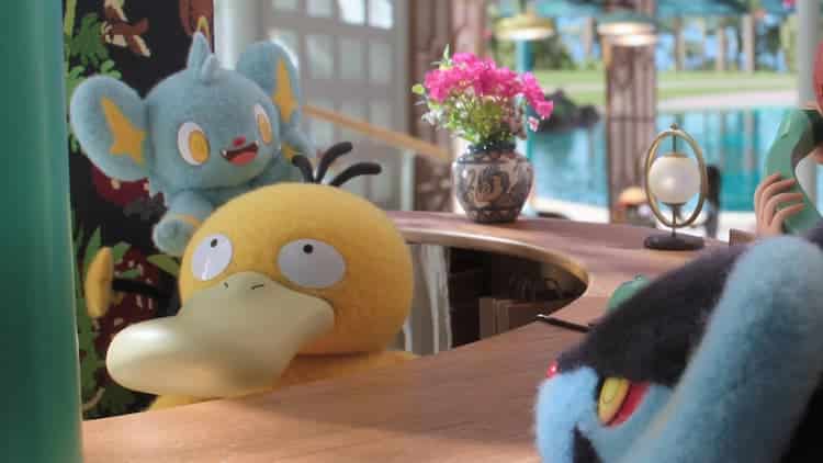 Psyduck is behind the concierge desk. Shinx is jumping onto Psyduck's head. They have an excited look in their eyes. Luxray is looking at Shinx with cautious eyes.